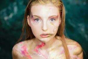 Young cute woman with creative make up photo