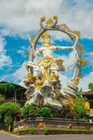 Traditional statue of the deity Arjuna photo