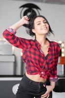 Playful brunette posing in a studio photo