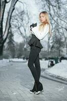 Pretty young woman posing in winter photo