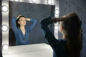 Beautiful woman dressed in denim overalls photo