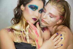 Two young women with creative make-up photo