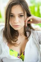 Portrait of nice brunette posing in summer photo