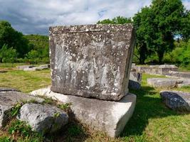 Stecci Medieval Tombstones Graveyards in Boljuni, Bosnia and Herzegovina. Unesco site. Historic place of interest. The tombstones feature a wide range of decorative motifs and inscriptions. photo