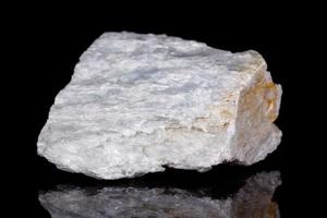 Macro mineral stone Talc on black background photo