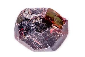 Macro of a mineral garnet stone on a white background photo