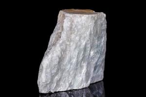 Macro mineral stone Talc on black background photo