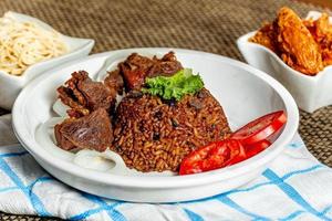 jollof rice with mean - vegetable and fruits photo