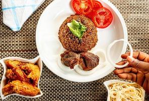 jollof rice with mean - vegetable and fruits photo