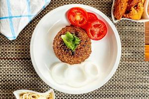 jollof rice with mean - vegetable and fruits photo