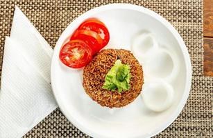 jollof rice with mean - vegetable and fruits photo