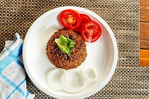 jollof rice with mean - vegetable and fruits photo