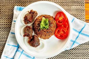 jollof rice with mean - vegetable and fruits photo
