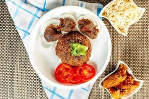 jollof rice with mean - vegetable and fruits photo