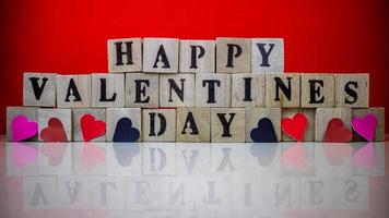 Happy valentine day on wooden blocks photo