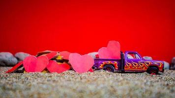 Minahasa, Indonesia  December 2022, the toy cars transporting hearts photo