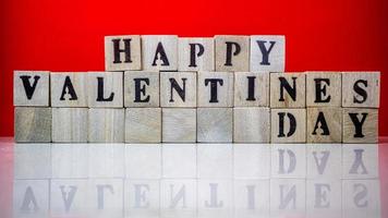 Happy valentine day on wooden blocks photo