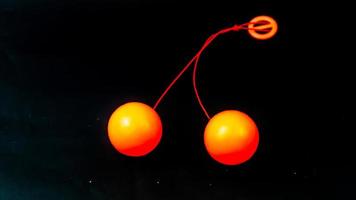 toy lato lato orange on black background photo