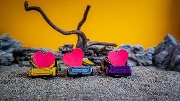 Minahasa, Indonesia  December 2022, the toy cars transporting hearts photo