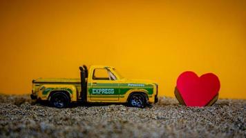 Minahasa, Indonesia December 2022, the toy car with a heart in front of it photo