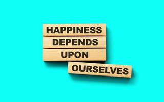 de madera bloques felicidad depende sobre Nosotros mismos palabra 3d ilustración foto