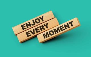 Wooden blocks enjoy every moment word isolated background 3d illustration photo