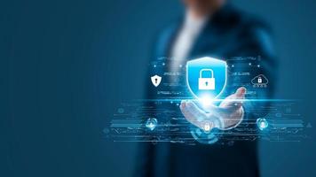 Cybersecurity Privacy data protection concept, businessman holding key protect business and financial data with virtual network connection, security internet access, security encryption. photo