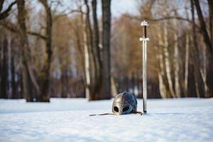 Image of silver sword and helmet fantasy medieval period photo