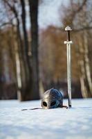 Image of silver sword and helmet fantasy medieval period photo