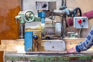 making furniture on a machine in a joinery photo