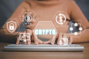Cryptocurrency concept, Person hand typing on keyboard computer with cryptocurrency icon on virtual screen. photo