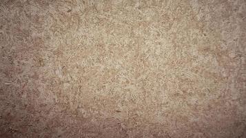 Surface texture of brown speckled wallpaper for background. Old wallpaper texture. Abstract photo