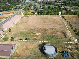 Land plot for building house aerial view, land field with pins, pin location for housing subdivision residential development owned sale rent buy or investment home or house expand the city suburb photo