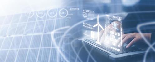 Business person engineers are using laptops to monitor the operation of solar, concept of environmental, Business preserving resources, reducing CO2, Caring for employees, Renewable energy concept. photo