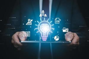 Innovative technology in science and communication concepts, and Creativity with glowing light bulbs.Hand hold light bulb with new idea concept with innovation, the new idea with energy and power photo
