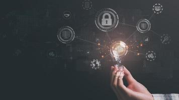 man holding a light bulb, digital network data connection technology modern communication with information technology, innovative online backup with highly secured protection, cloud computing concept photo