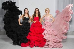 Three nice woman posing in the studio photo