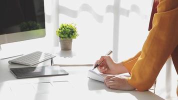 Diverse female fashion designers at work with tailor centimeters on necks and holds tablet and notepad. independent creative design business. video