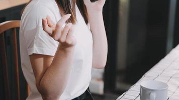 Asian Business woman using calculator and laptop for doing math finance on an office desk, tax, report, accounting, statistics, and analytical research concept video