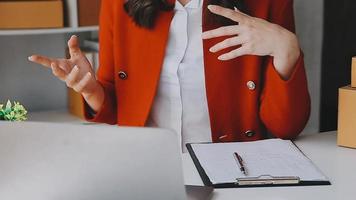 Diverse female fashion designers at work with tailor centimeters on necks and holds tablet and laptop. independent creative design business. video