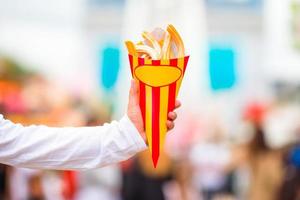 Hand holding churros photo