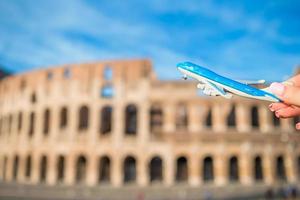 Miniature plane  in front of the Colosseum, Rome - Italy photo