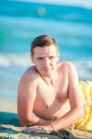 Young man on the beach photo