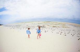 Little girls on the beach photo