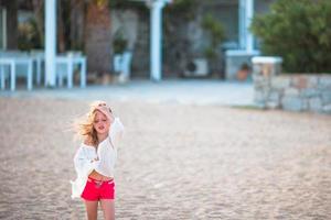 Little girl on the beach photo