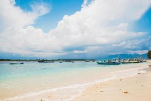 Surf on the sandy beach on a sunny day photo