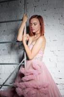 Nice young redhead woman posing in a studio photo