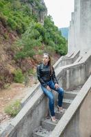 Young beautiful woman posing sitting photo