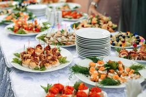 light snacks, canapes on a festive table photo