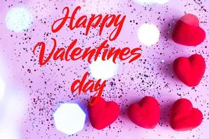 Happy valentine's day text on Pink Background with Hearts. photo